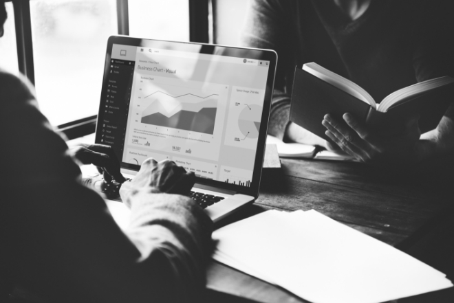 financial data analysis on laptop with charts and business intelligence tools for finance and insurance operations