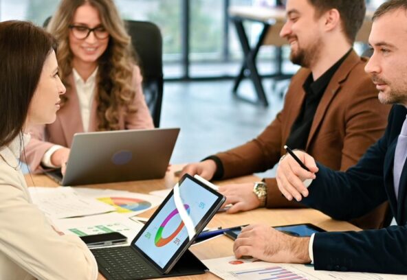 Business meeting discussing website conversion optimization — DETAY Tech insights