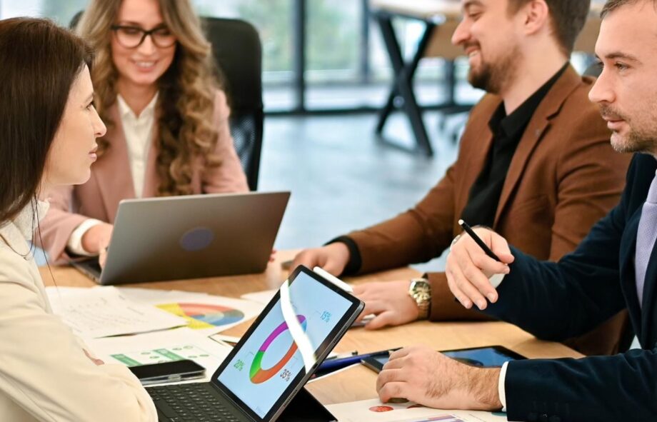 Business meeting discussing website conversion optimization — DETAY Tech insights